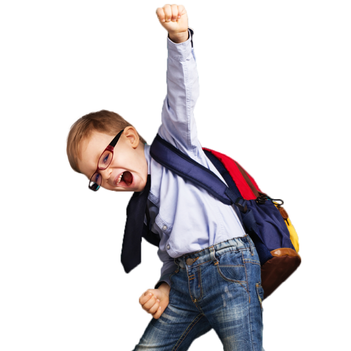Boy in school clothes punching the air in joy