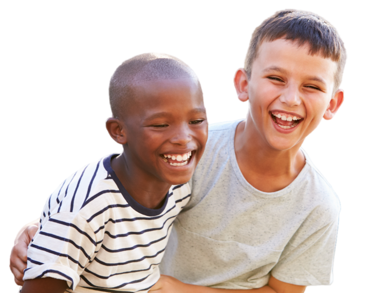 Two boys of primary school age and different ethnicities laughing