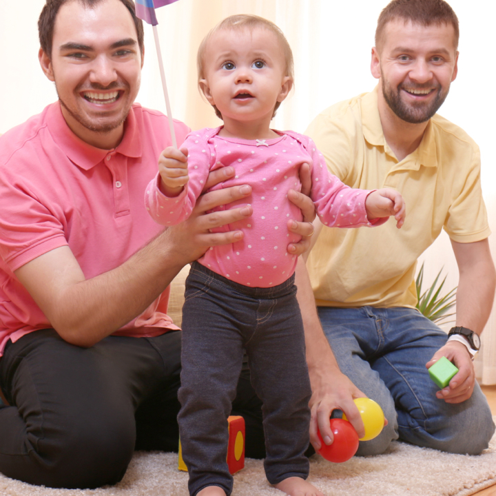A gay couple with their fostered toddler